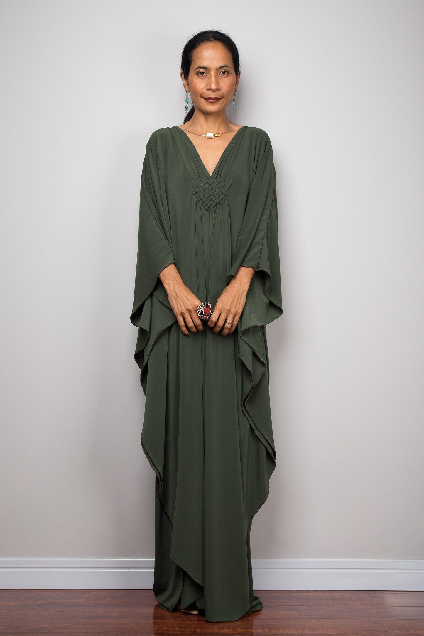 Green caftan dress with batwing sleeves and v neck.