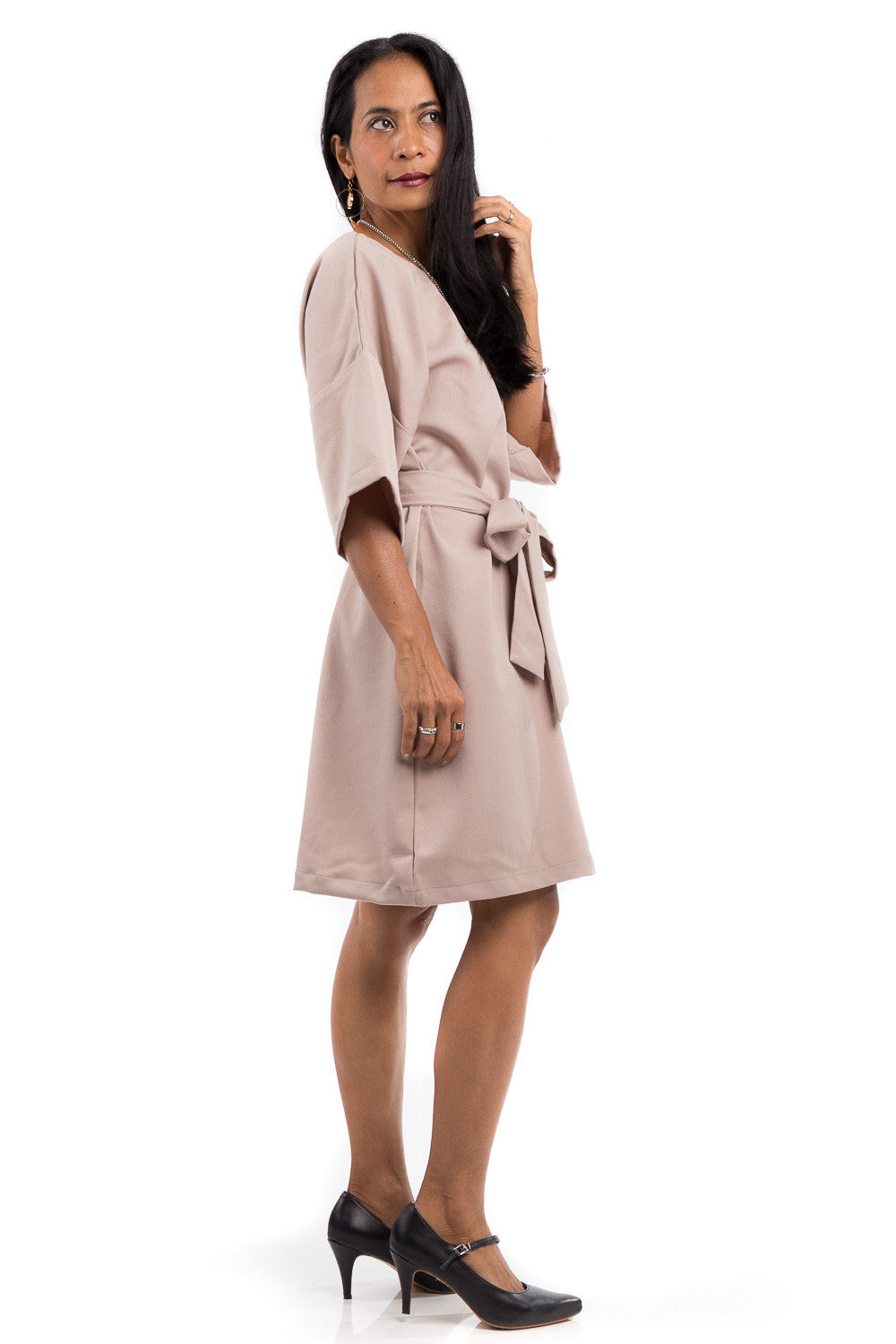 Short summer dress with half length sleeves.  Modest neckline with waistband accent.  Above the knee length dress.