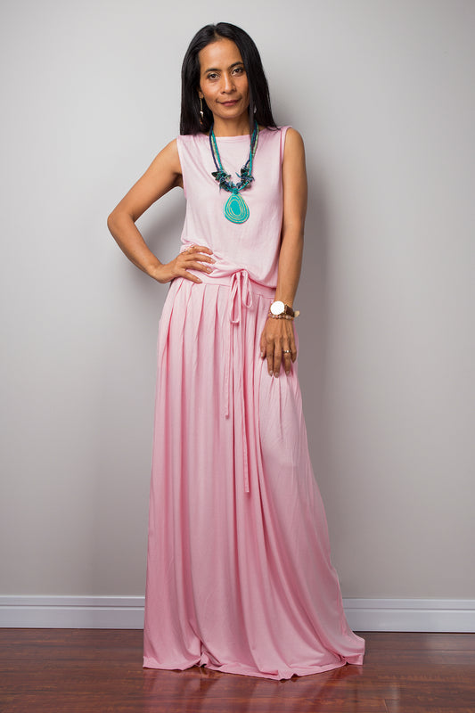 Baby pink sleeveless dress with high waist pleated skirt and pockets on each side.  A soft pink lounge dress by Nuichan