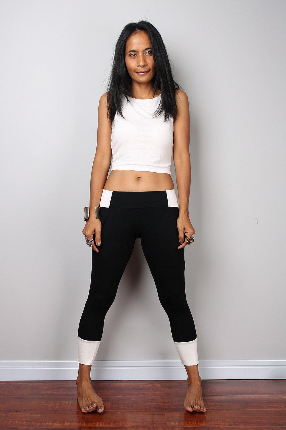 Black legging pants with white cuffs on the bottom, black yoga pants by Nuichan