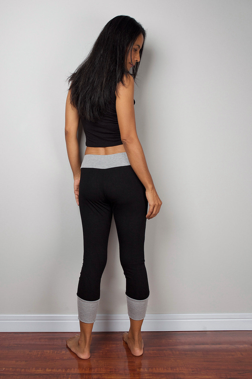 Black legging pants with grey cuffs on the bottom, black yoga pants by Nuichan