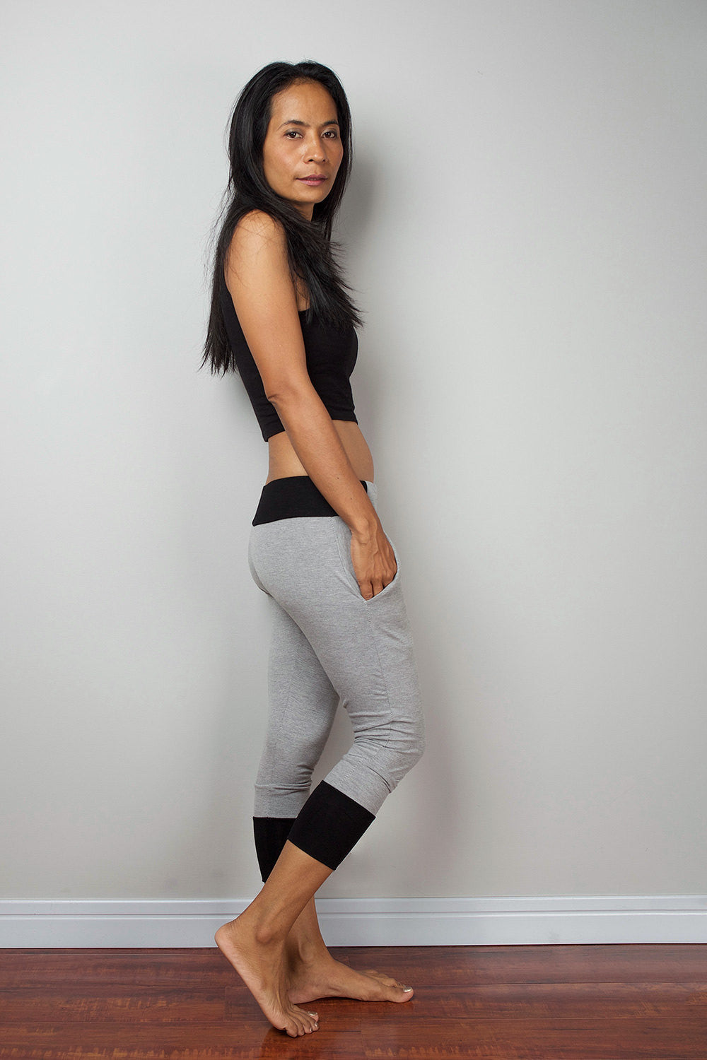 Grey legging pants with black cuffs on the bottom, grey yoga pants by Nuichan