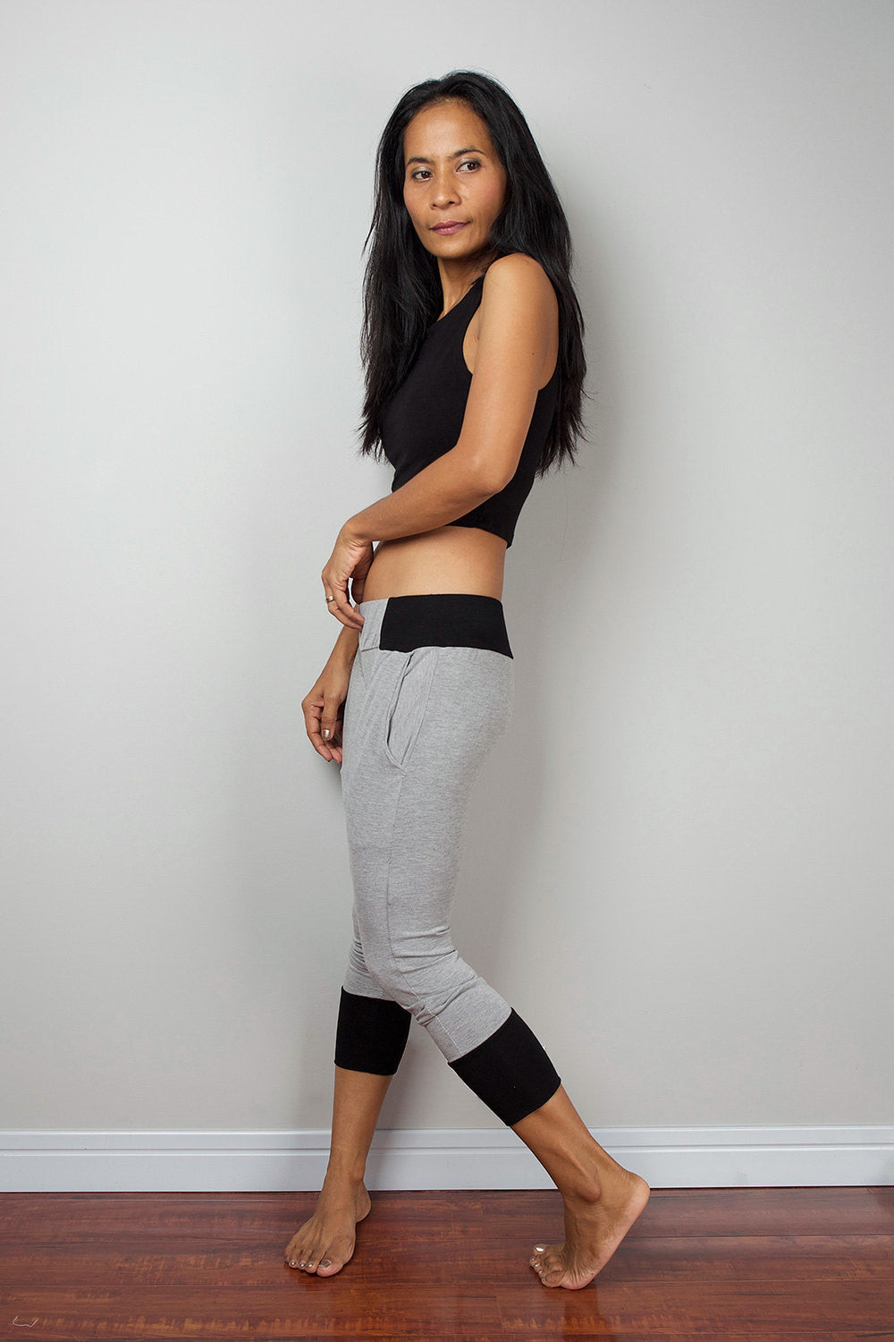 Grey legging pants with black cuffs on the bottom, grey yoga pants by Nuichan