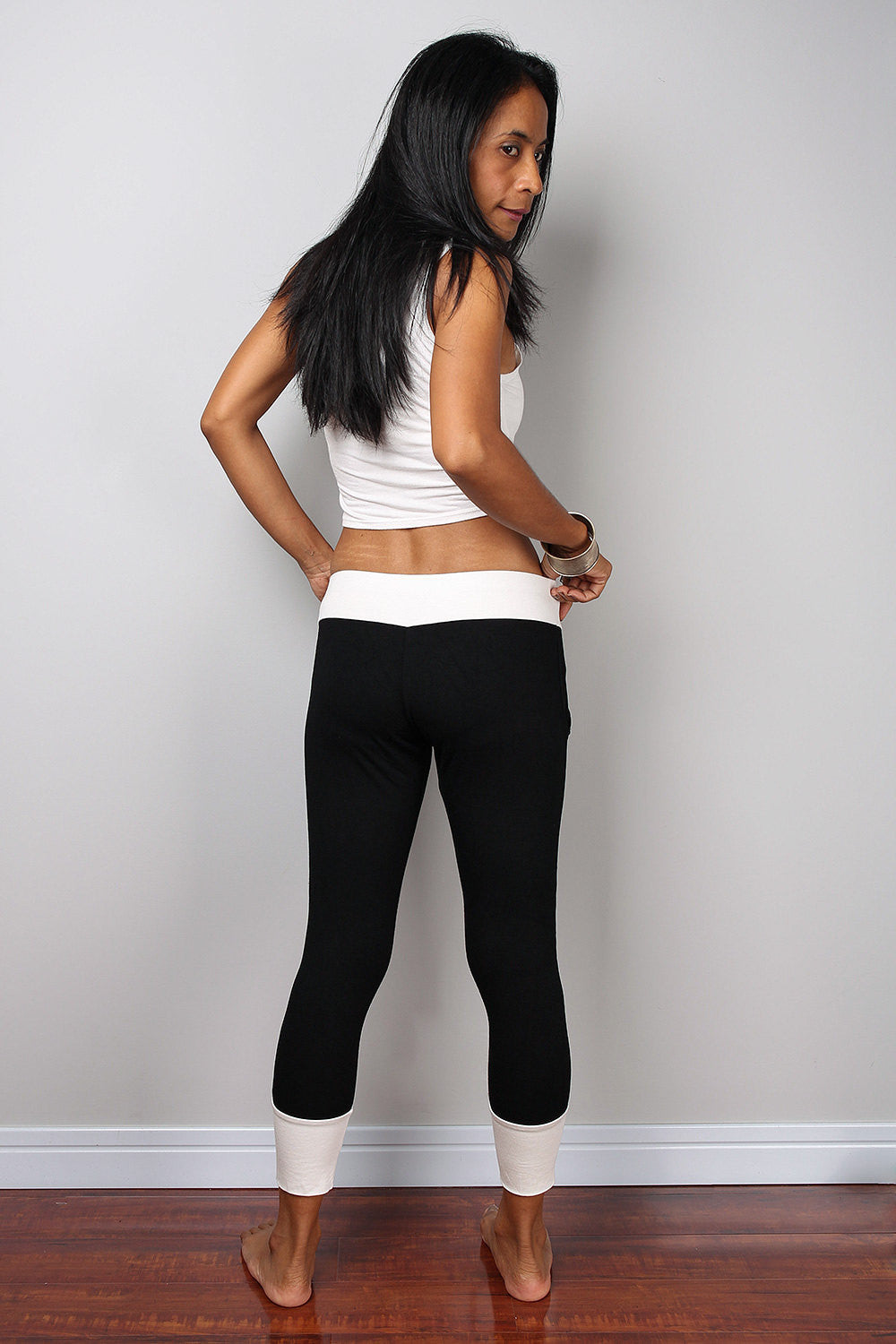 Black legging pants with white cuffs on the bottom, black yoga pants by Nuichan