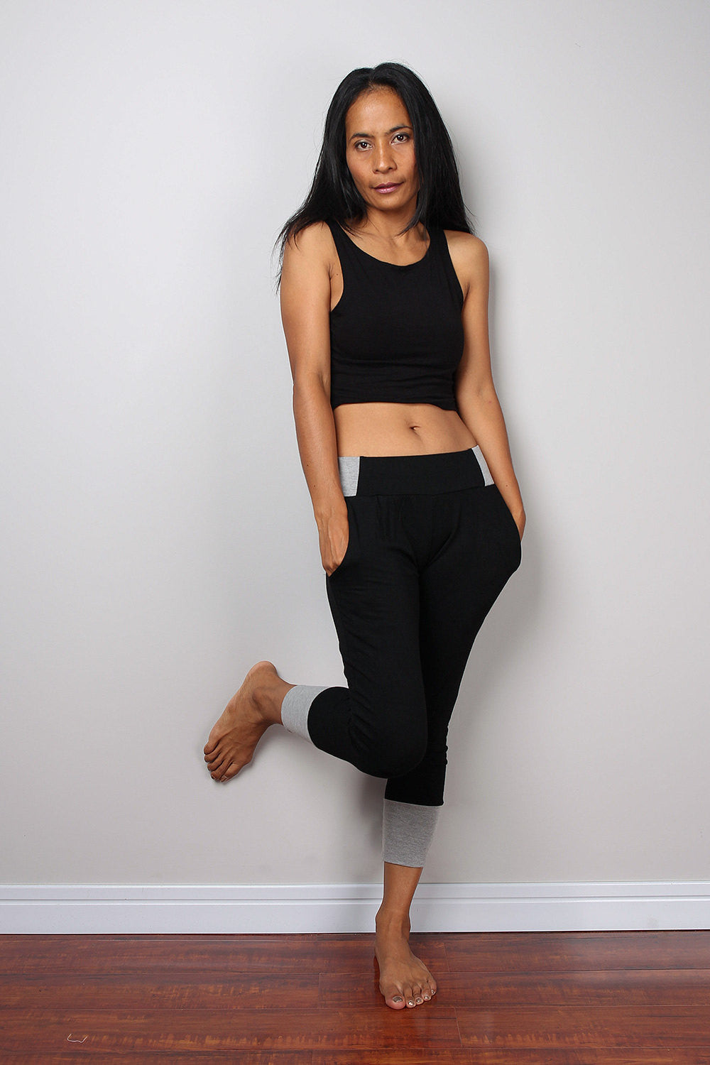 Black legging pants with grey cuffs on the bottom, black yoga pants by Nuichan