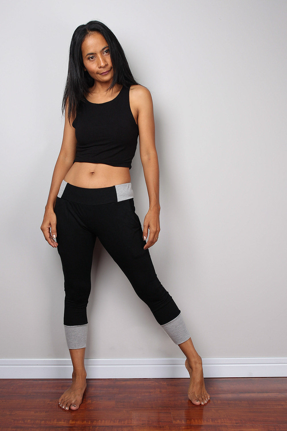 Black legging pants with grey cuffs on the bottom, black yoga pants by Nuichan