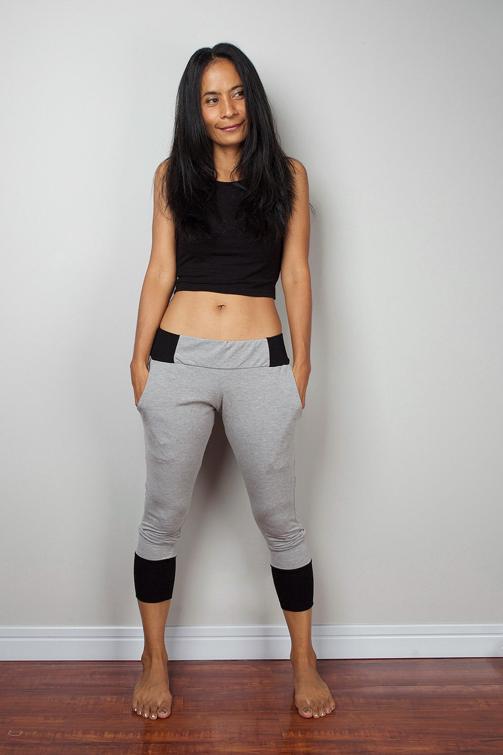 Grey legging pants with black cuffs on the bottom, grey yoga pants by Nuichan