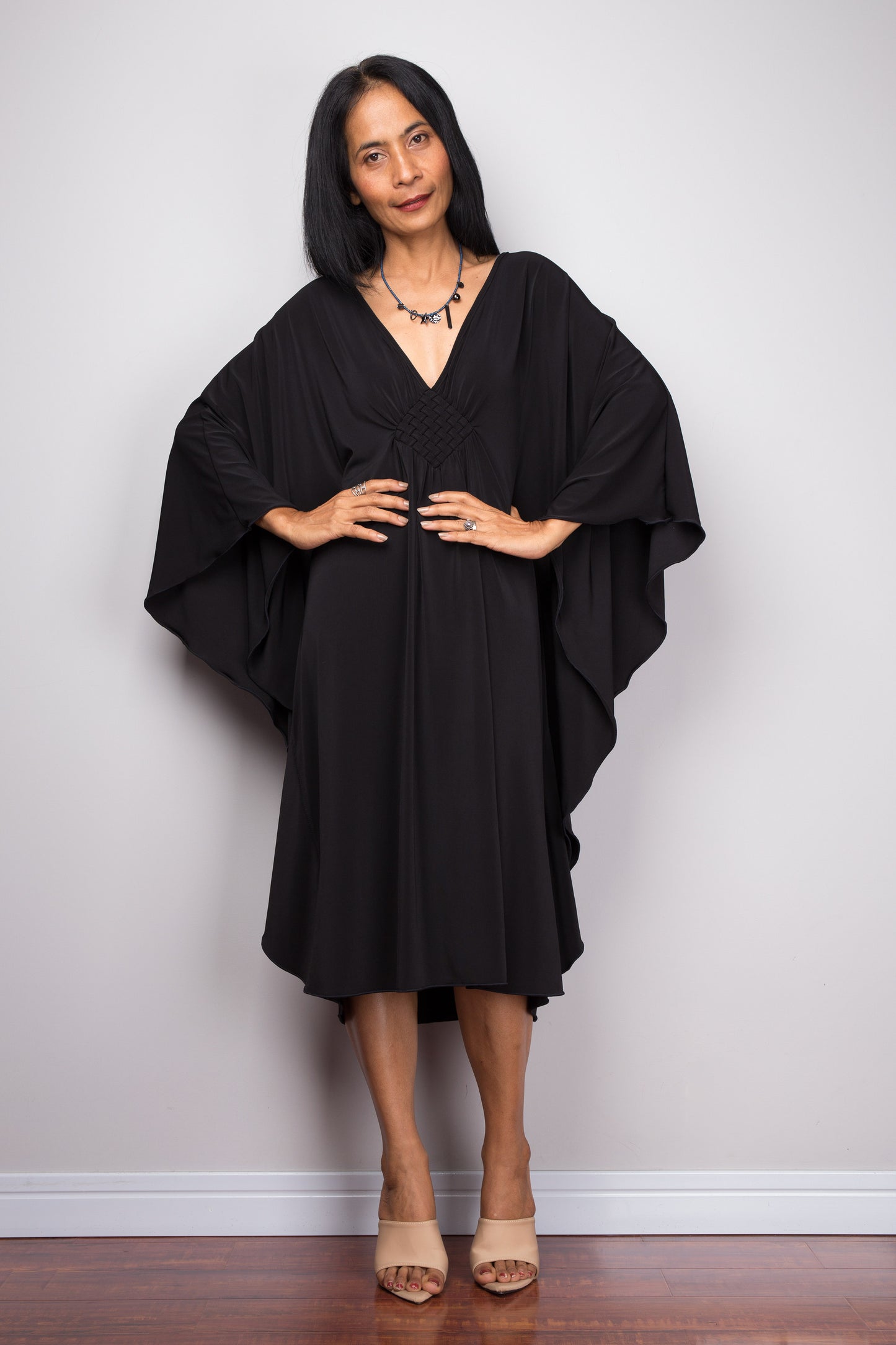 Buy Short black dress online.  Black kaftan dress  by Nuichan. Affordable black midi dress with plunging neckline