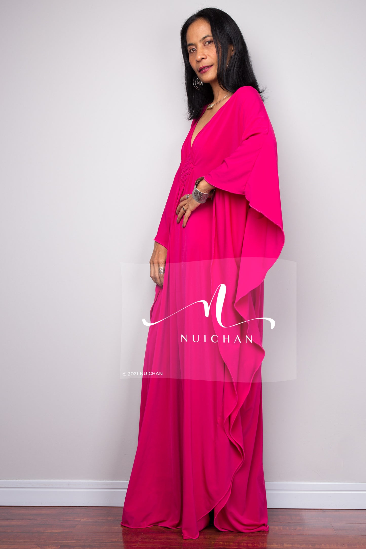 Hot pink kaftan dress, big batwing sleeves, side view