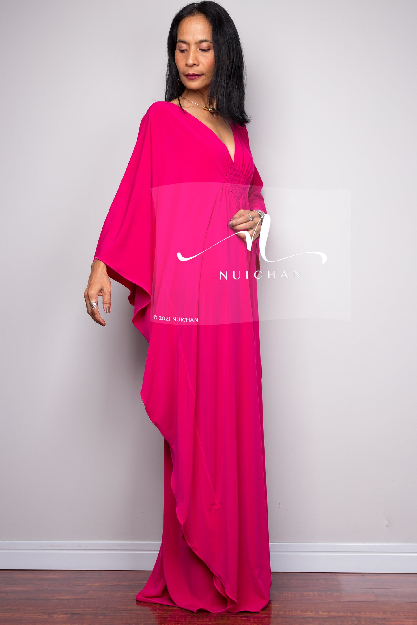 Long hot pink dress with batwing sleeve - side view