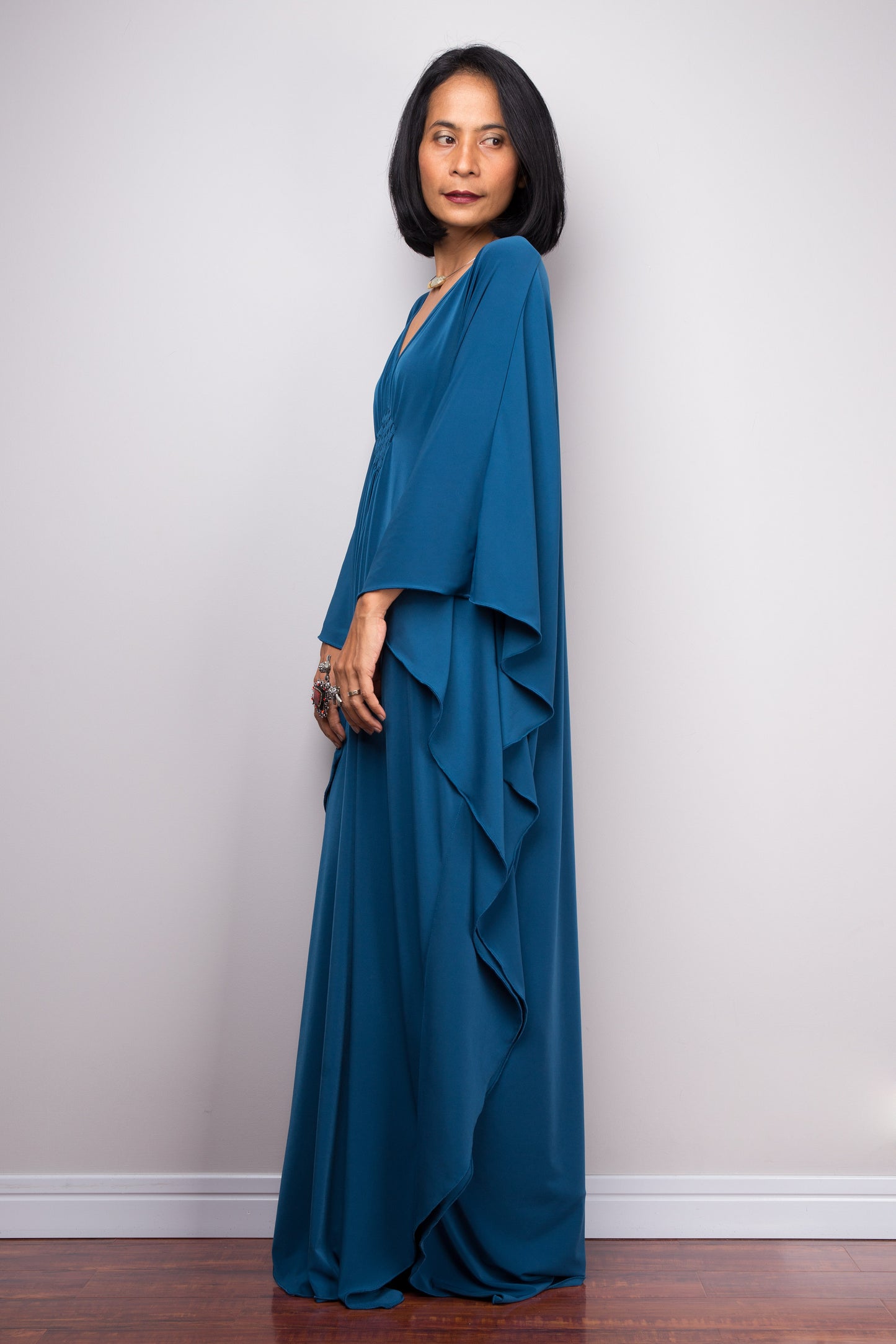 Long teal dress, kaftan style, side look