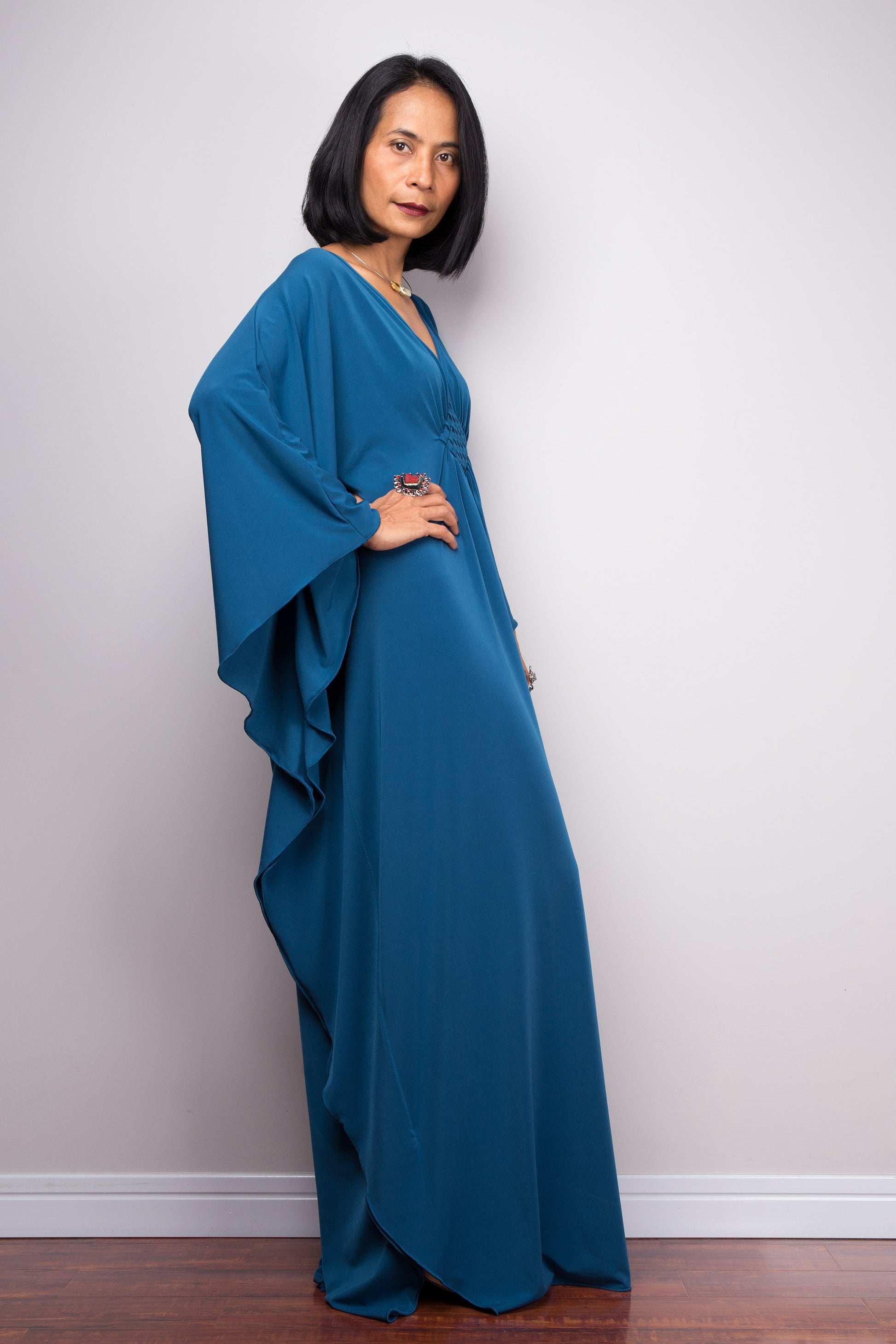 Long teal dress with batwing sleeve - side look