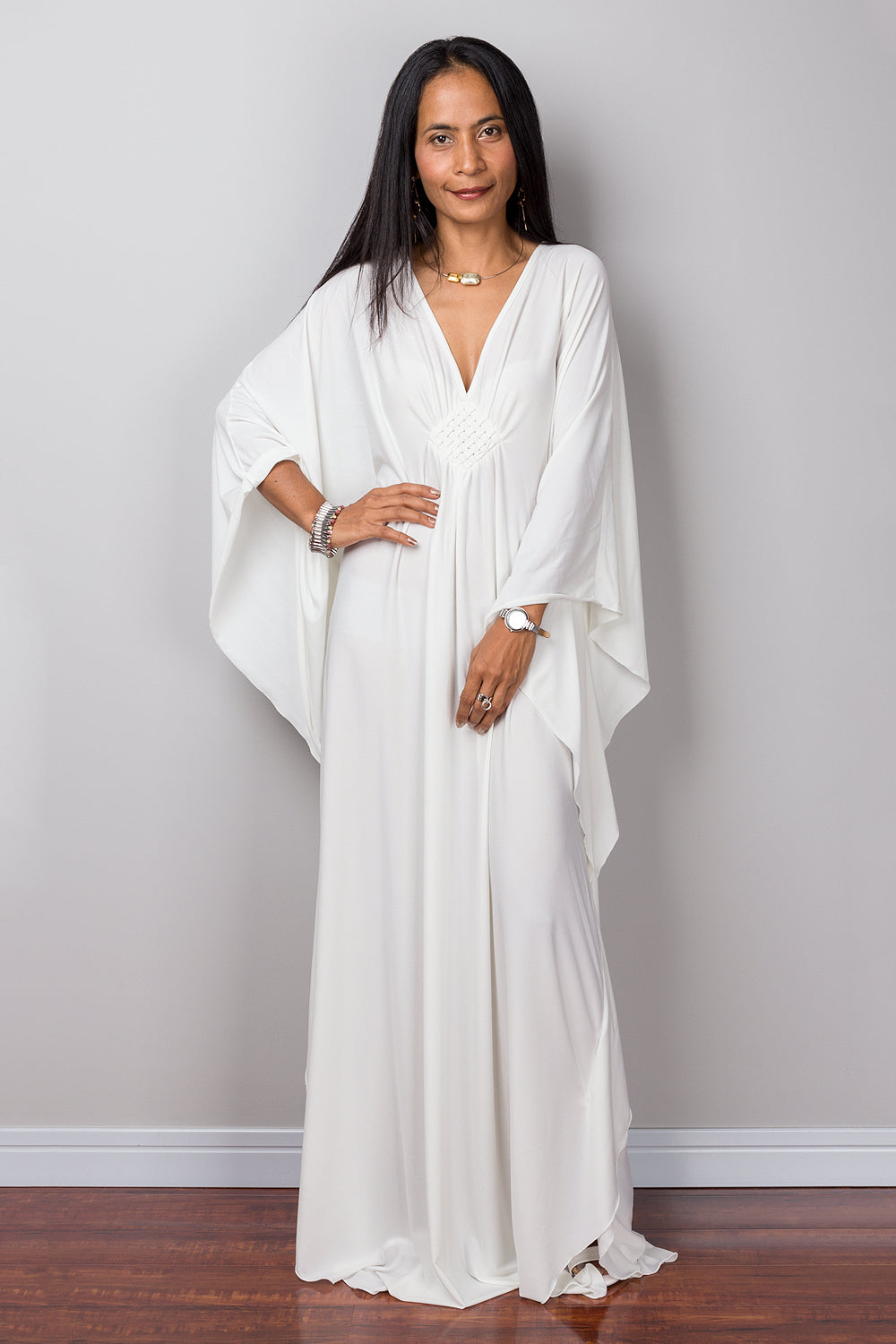 White caftan for women online.  Shop for long white maxi dress by Nuichan.  White frock dress with plunging neckline.