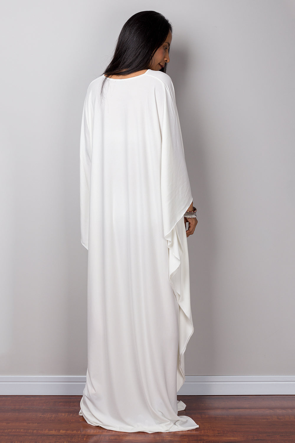 Buy Off white kaftan online.  Shop for white maxi dress by Nuichan.  White frock dress with plunging neckline.