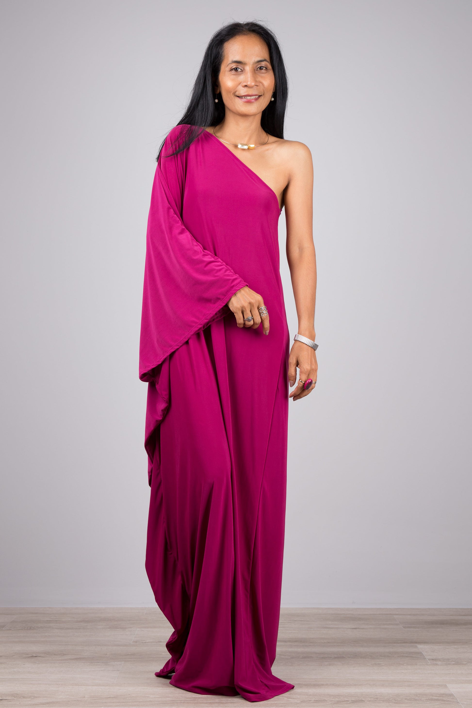 One shoulder kaftan dress by Nuichan.  Mulberry pink off the shoulder dress