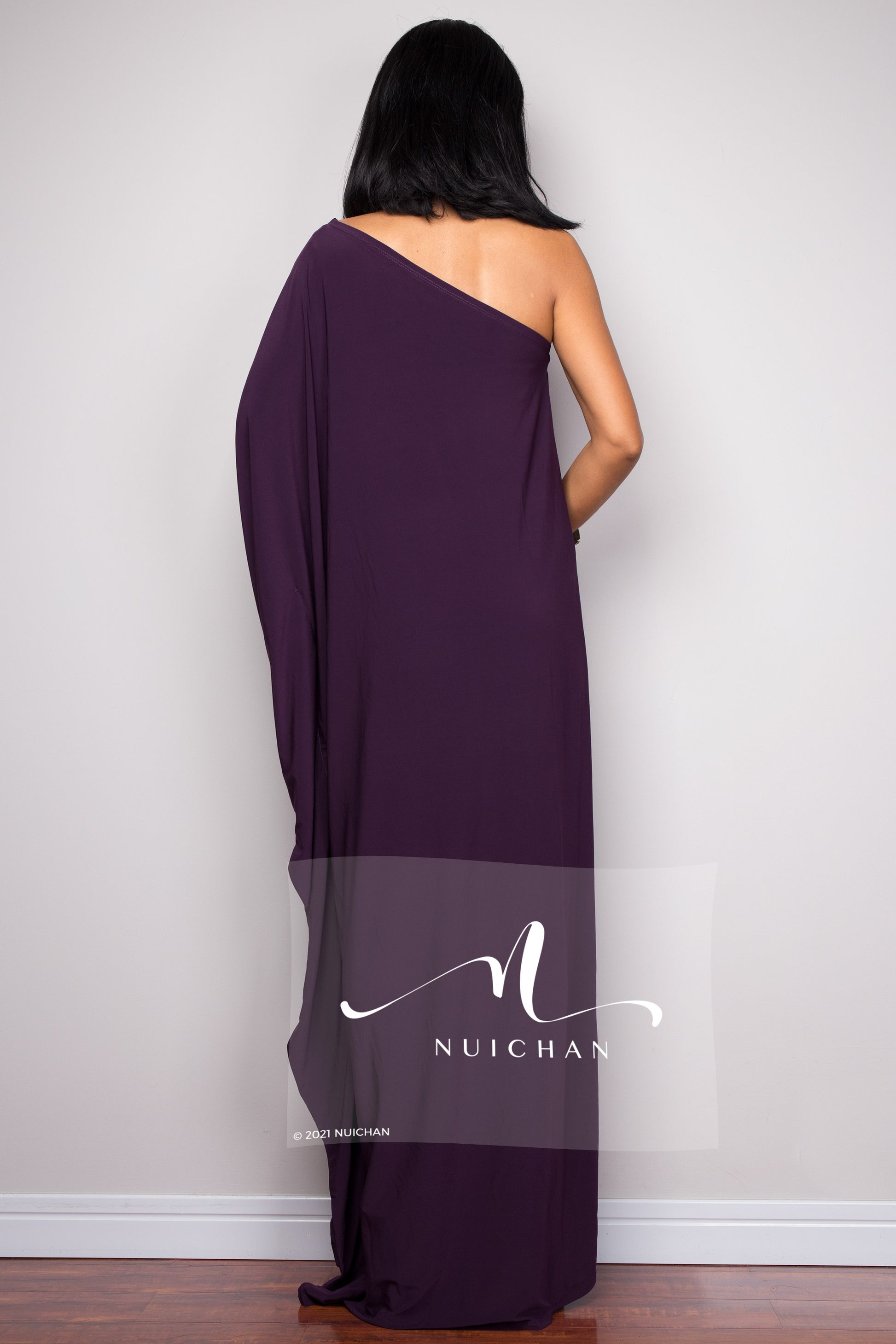 Sophisticated one-shoulder purple gown featuring a flowing silhouette - back view