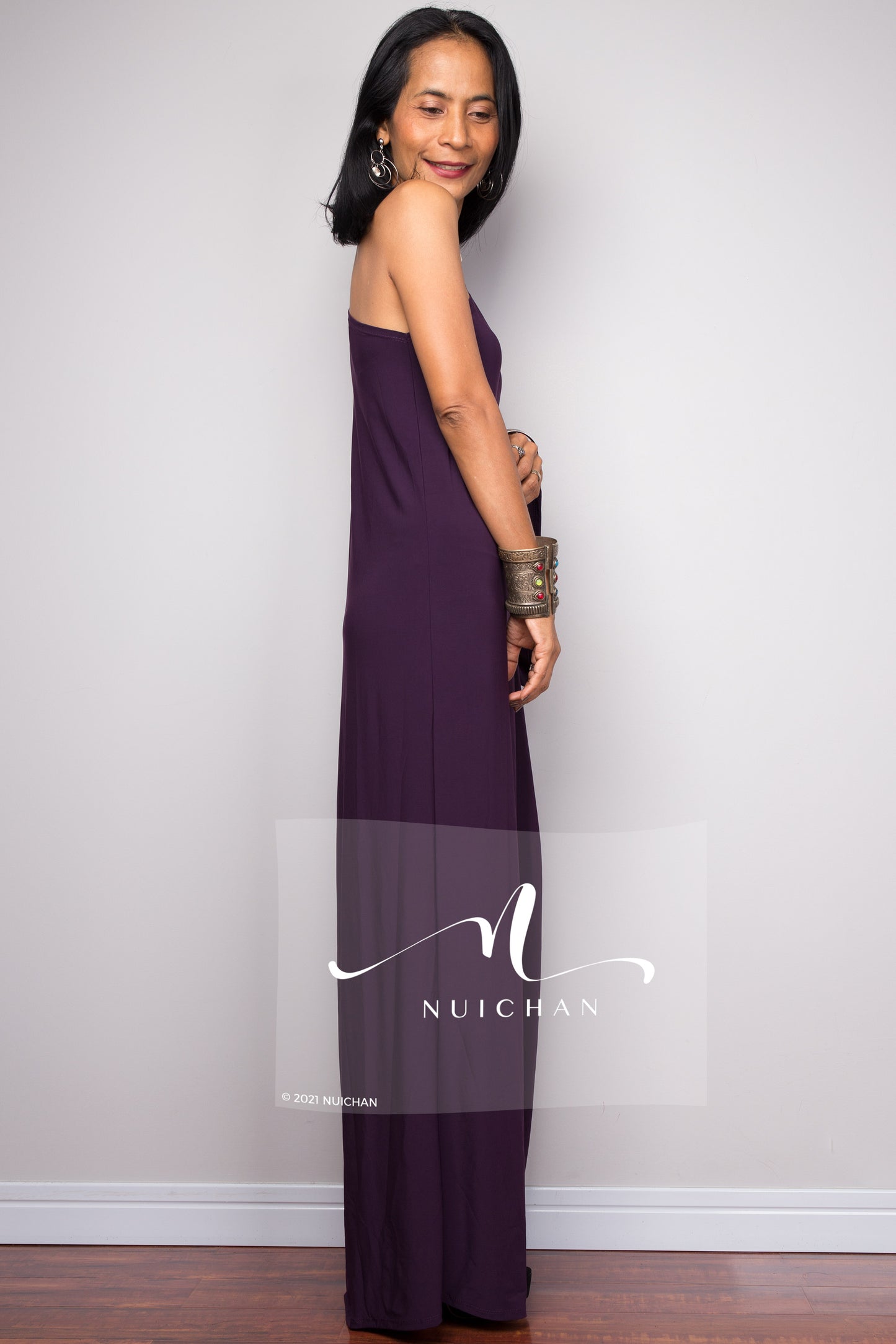 Alluring one-shoulder purple dress with a cascading silhouette, suitable for formal events