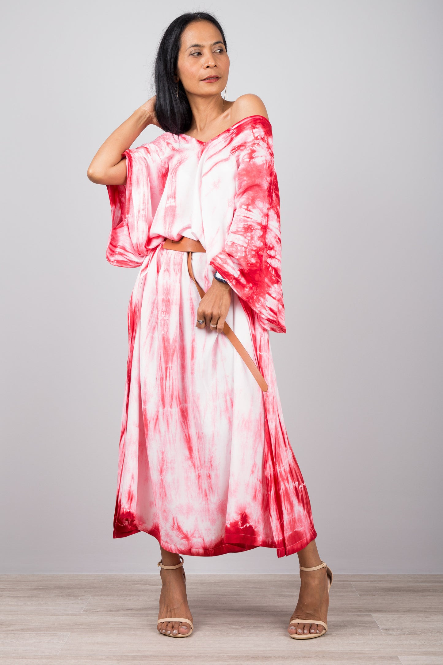 Red and white shibori tie dye kaftan dress, here shown clinched with a belt at the waist