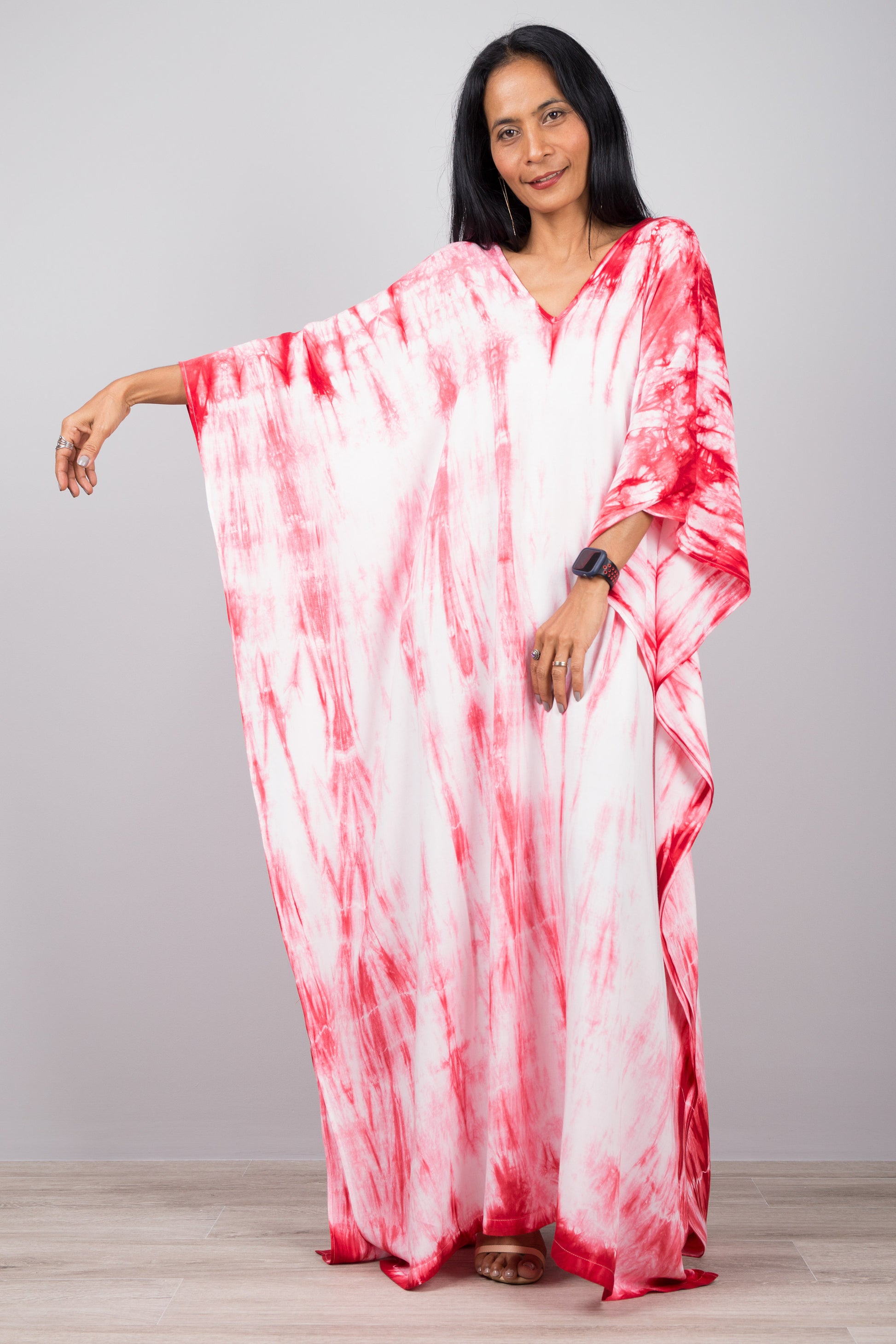 Red and white tie dye shibori dress with loose fit design.  Here shown with stretched out sleeve