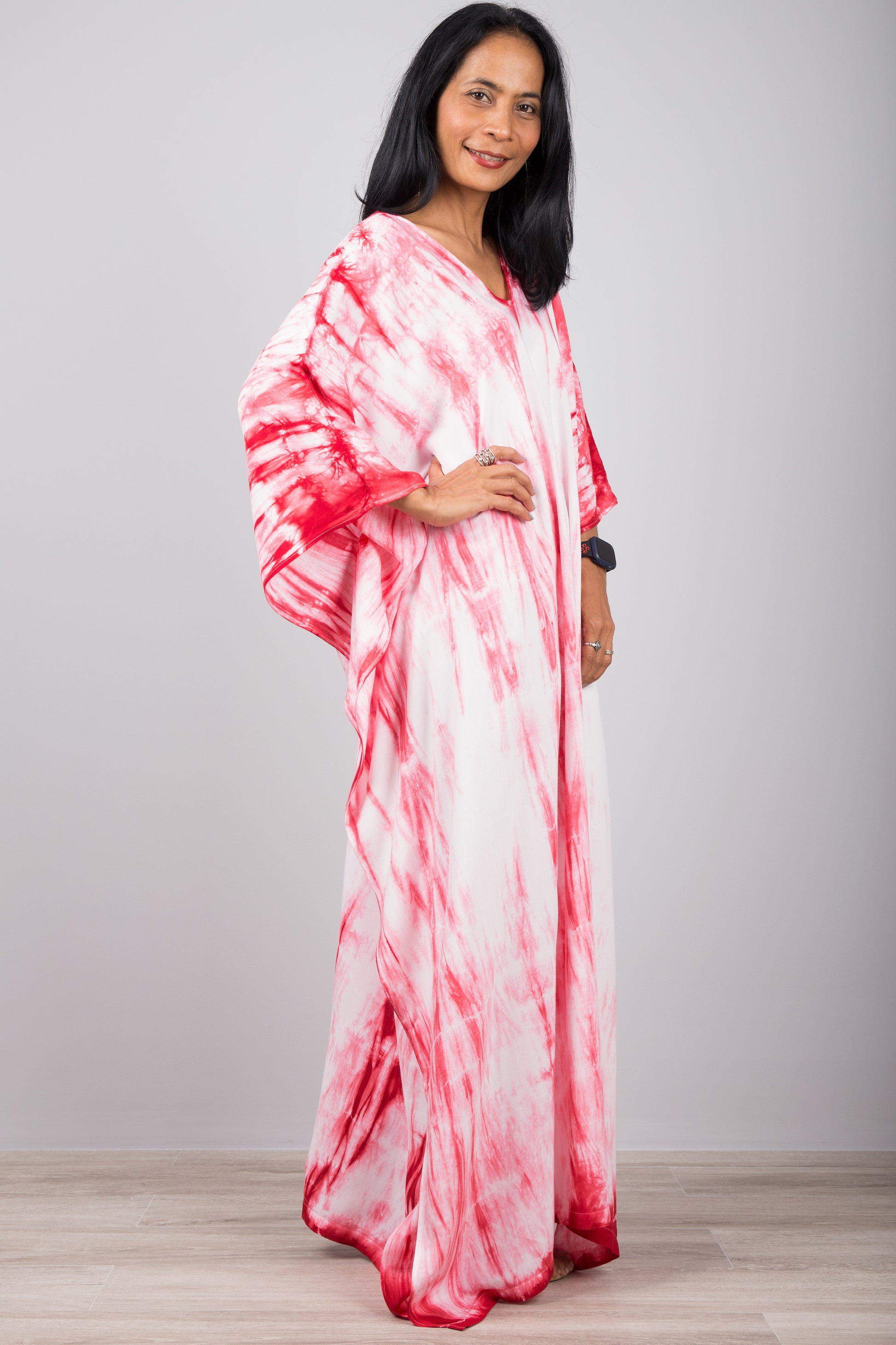 Red and white tie dye kaftan dress.  Side view