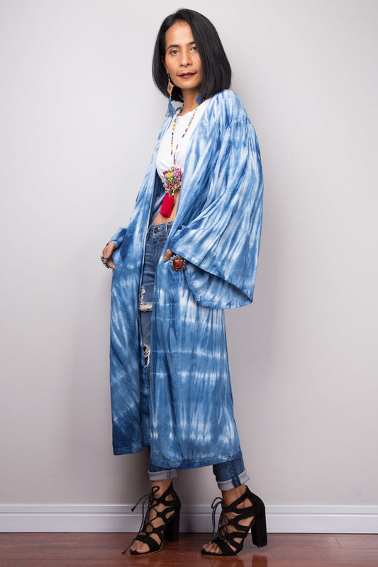 Woman wearing natural indigo shibori tie-dye open front cardigan with pockets