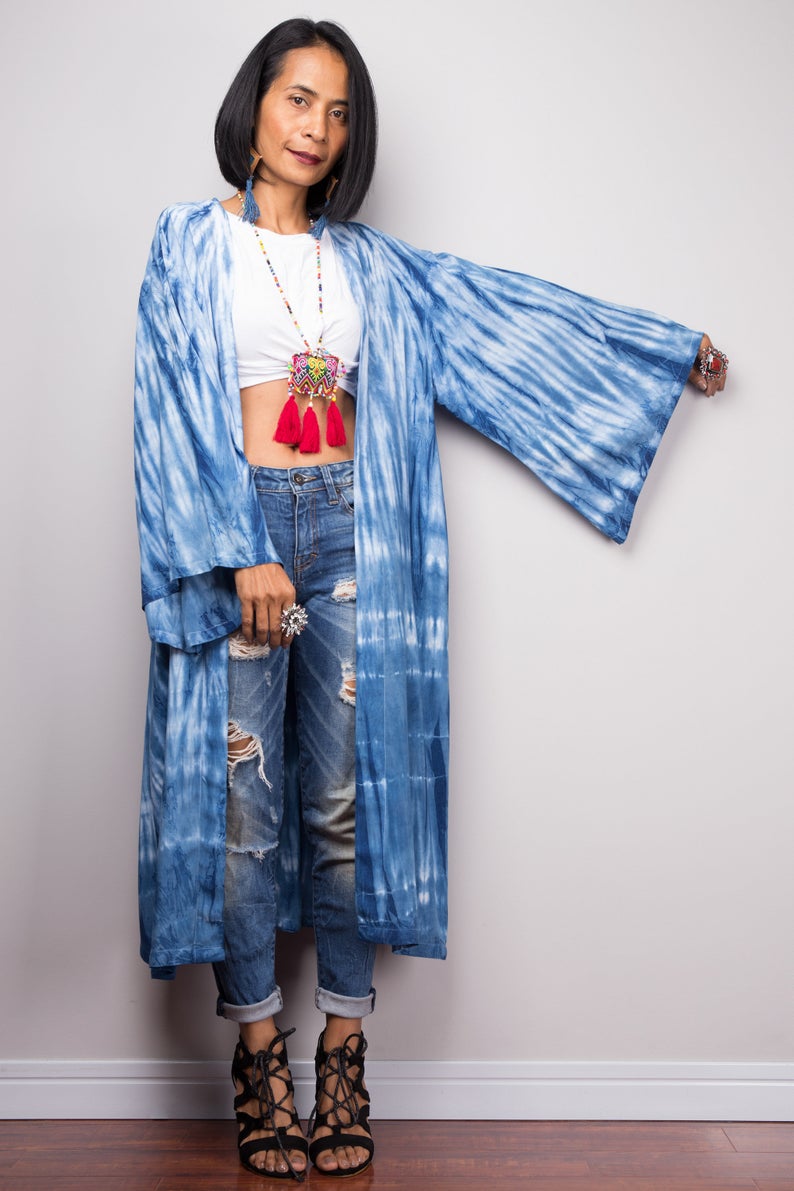 Model showcasing the flow of the long-sleeved, open-front shibori cardigan, perfect for layering