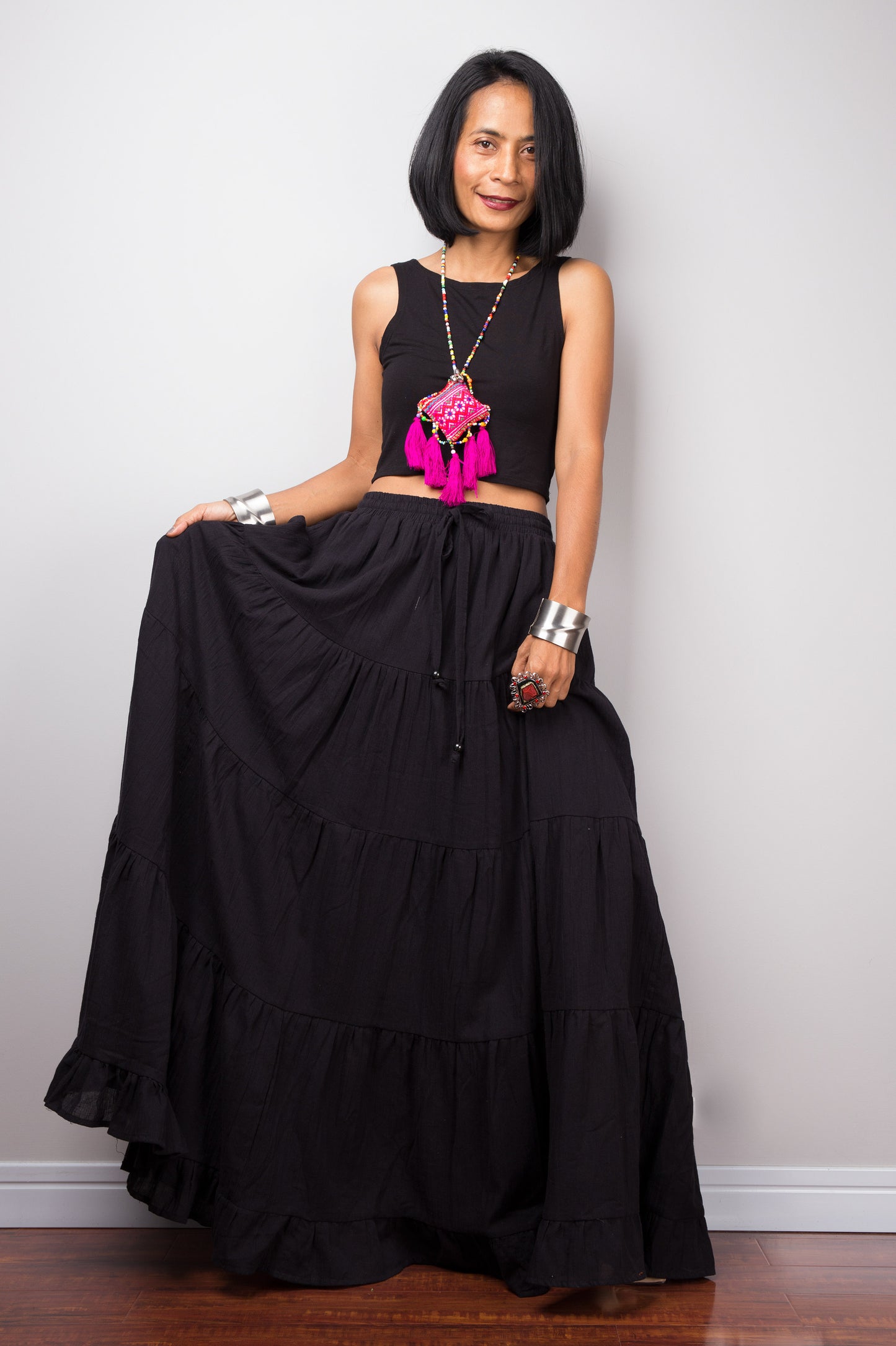 Black long cotton skirt by Nuichan. Front view