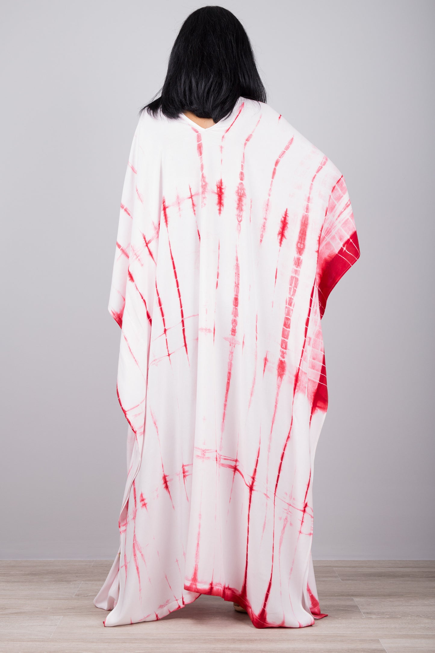 White and red tie dye kaftan dress by Nuichan. Back view