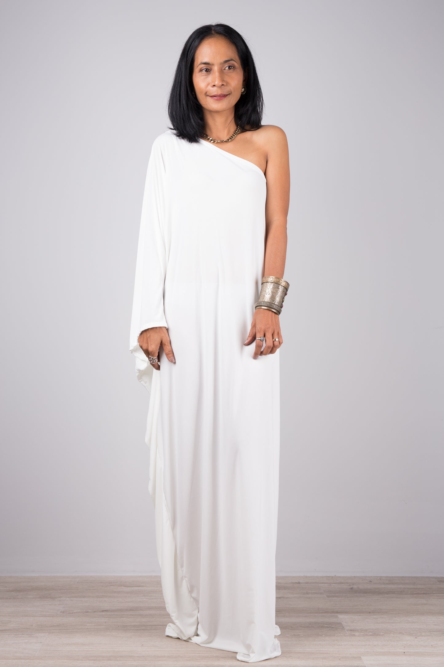 Long white one shoulder caftan by Nuichan